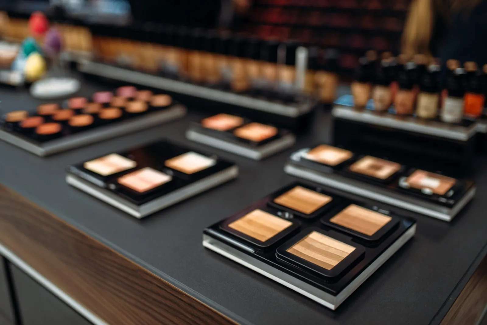 Professional makeup products arranged at a beauty counter